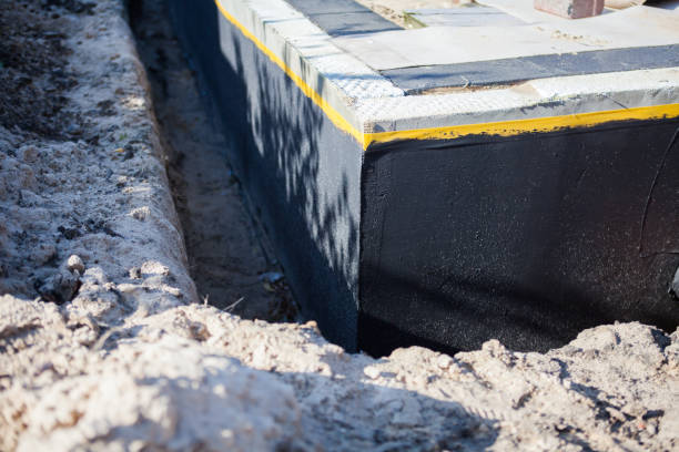 Professional Basement Waterproofing technician working in Oak Creek, WI
